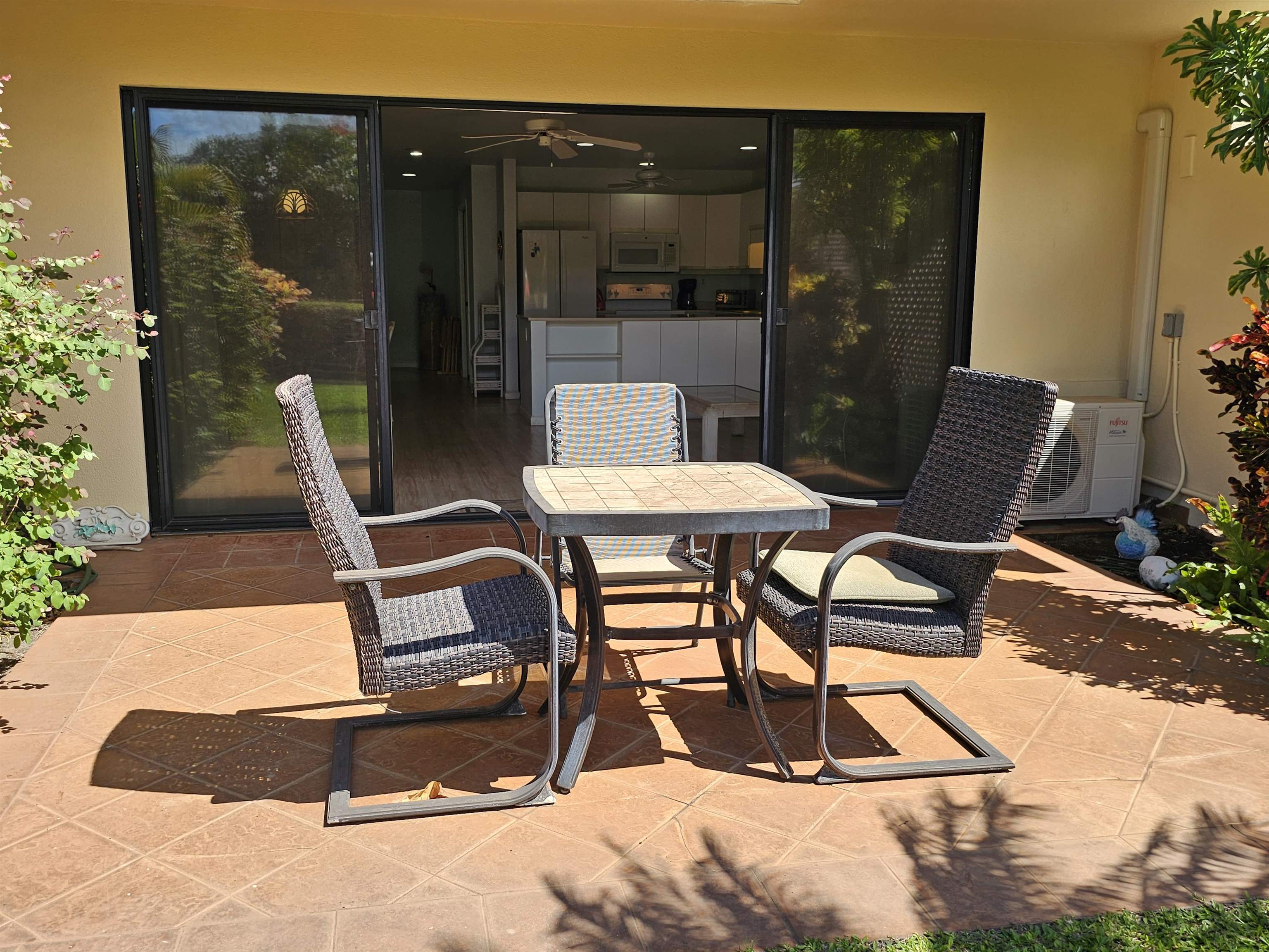 2777 South Kihei Road, Unit K107 Kihei, HI 96753 - Photo 17 of 50 a view of a patio with table and chairs and potted plants