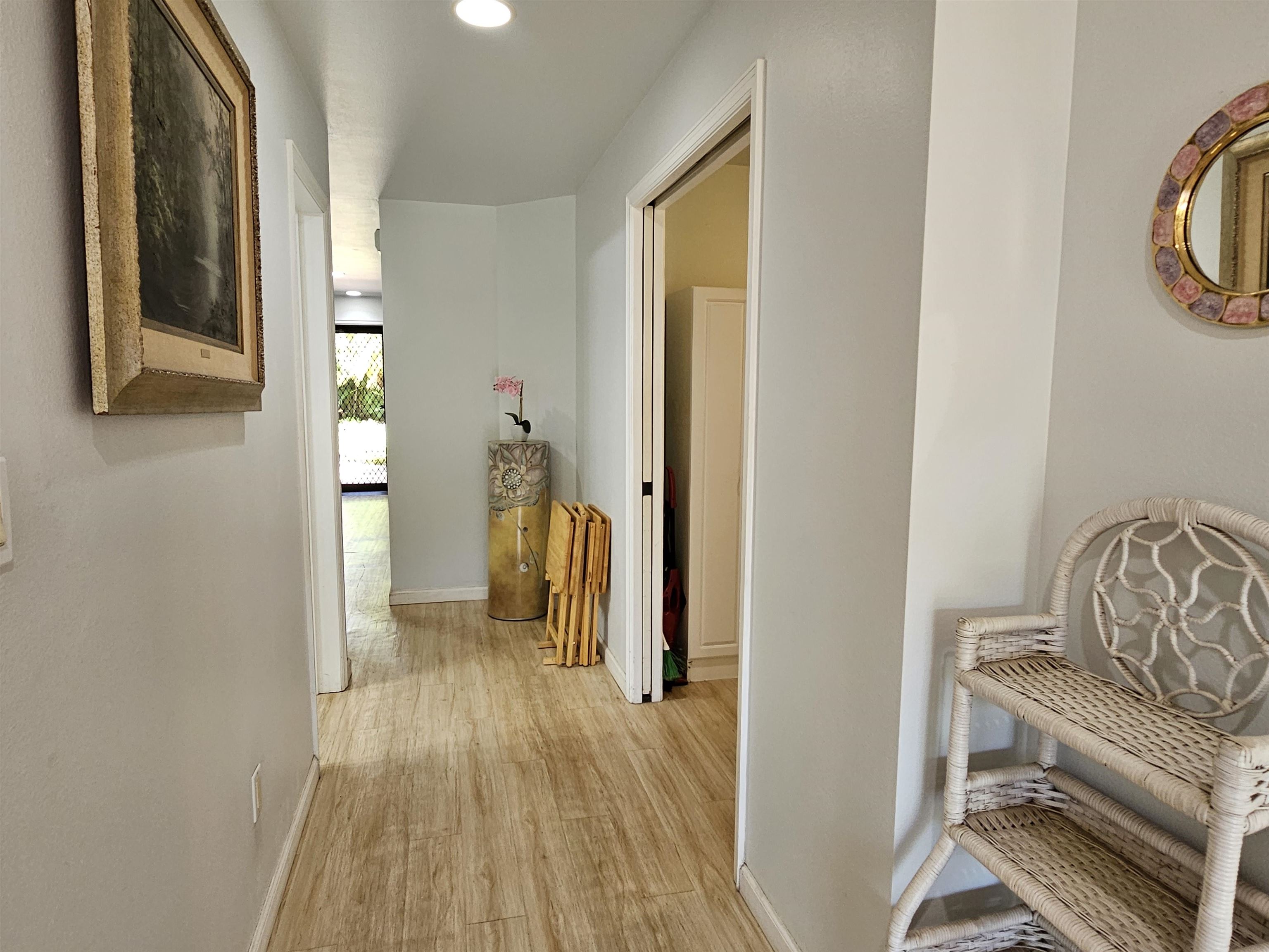2777 South Kihei Road, Unit K107 Kihei, HI 96753 - Photo 21 of 50 a view of a bedroom with wooden floor and furniture