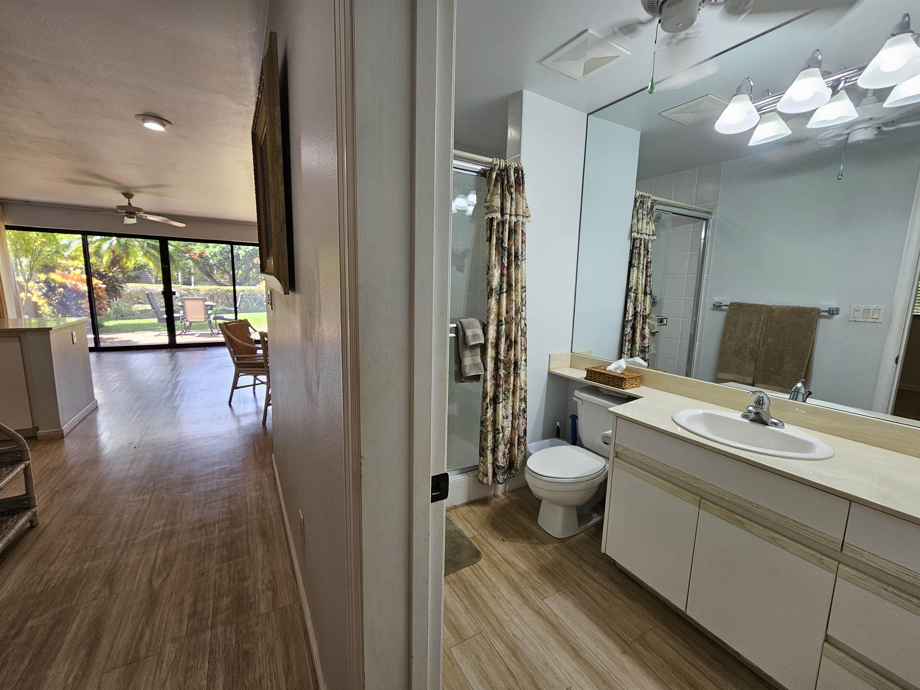2777 South Kihei Road, Unit K107 Kihei, HI 96753 - Photo 23 of 50 a bathroom with a toilet a sink and a large mirror