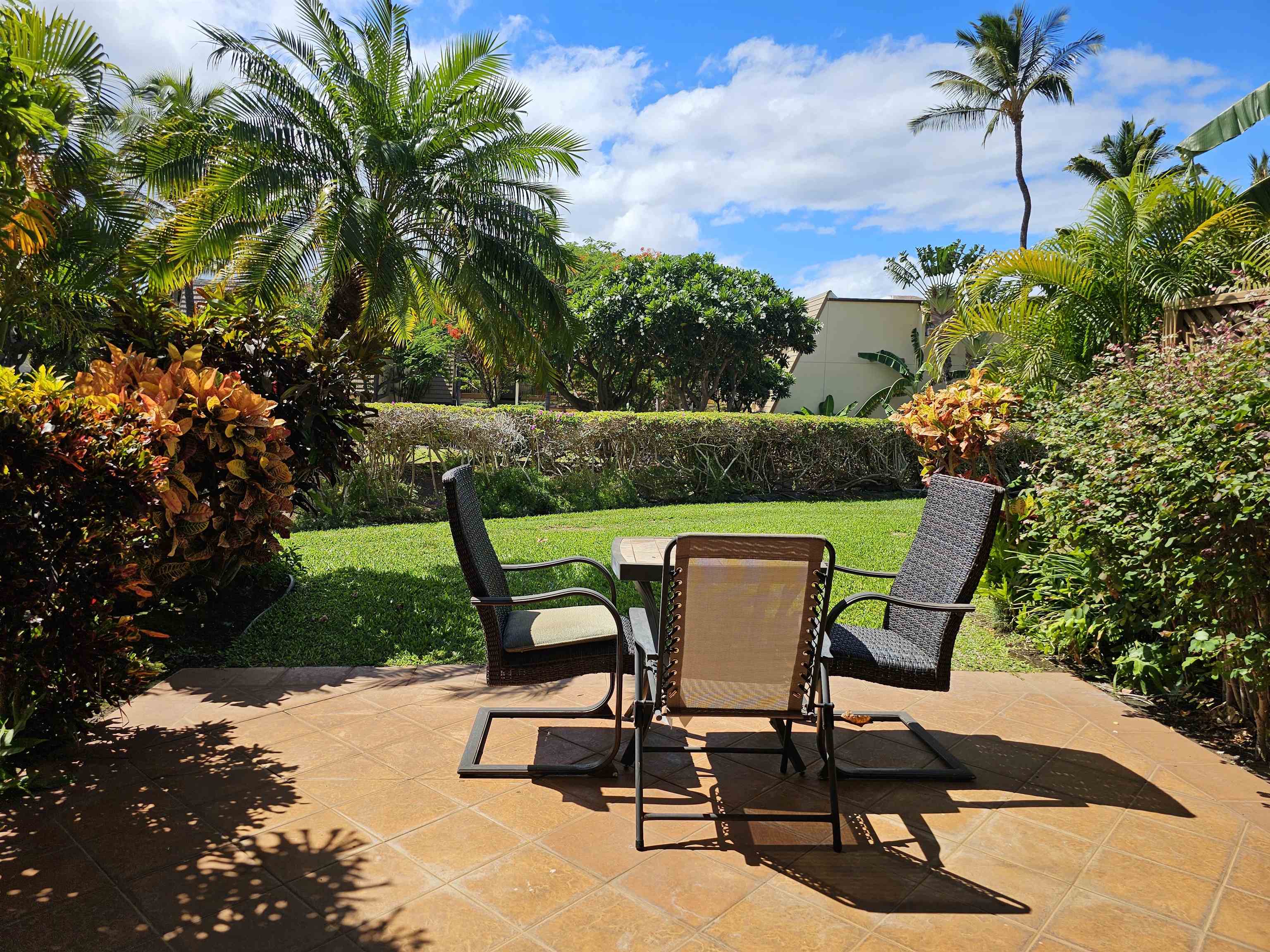 2777 South Kihei Road, Unit K107 Kihei, HI 96753 - Photo 3 of 50 a patio with table and chairs