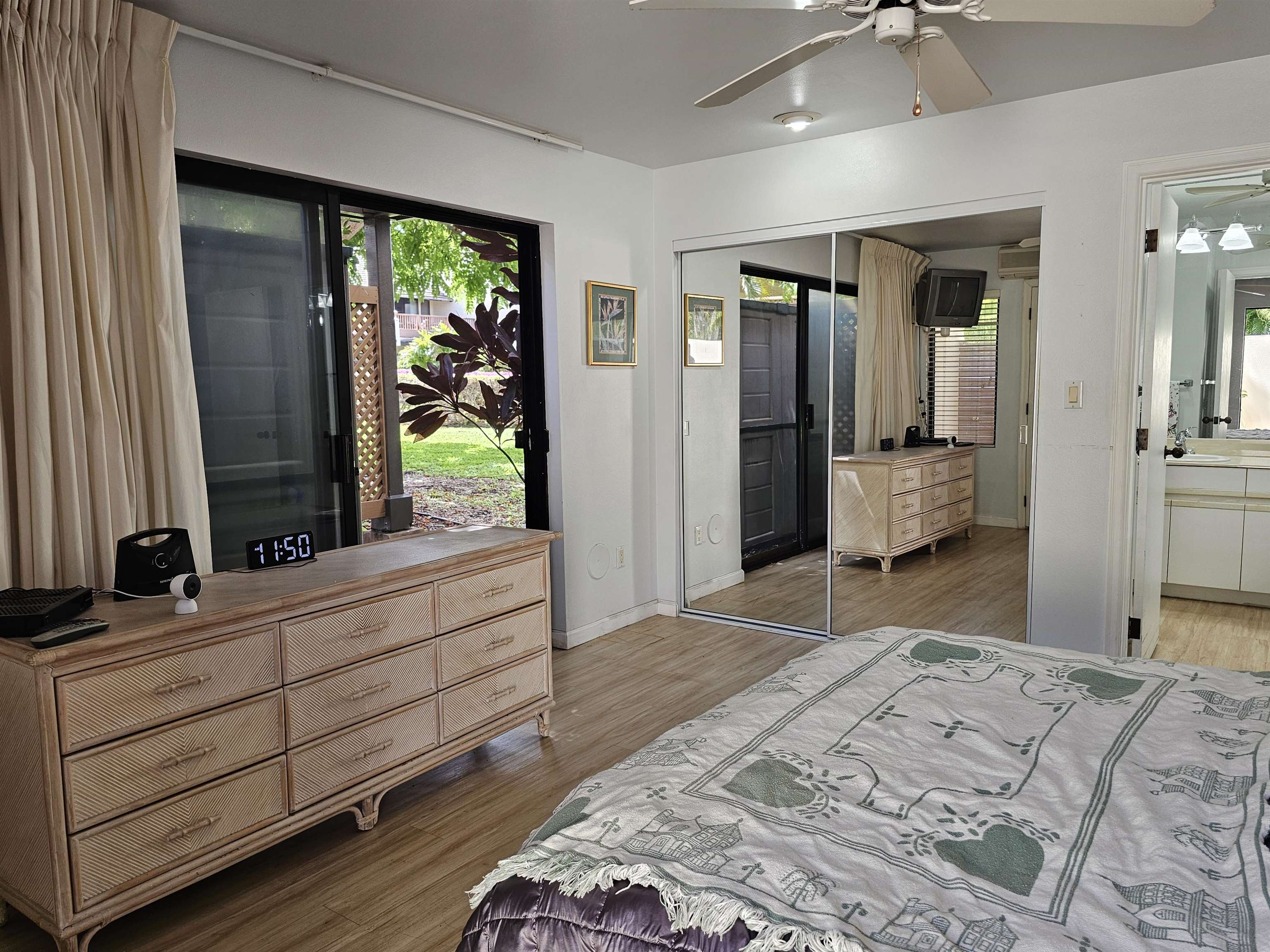 2777 South Kihei Road, Unit K107 Kihei, HI 96753 - Photo 37 of 50 a bedroom with a bed and large windows