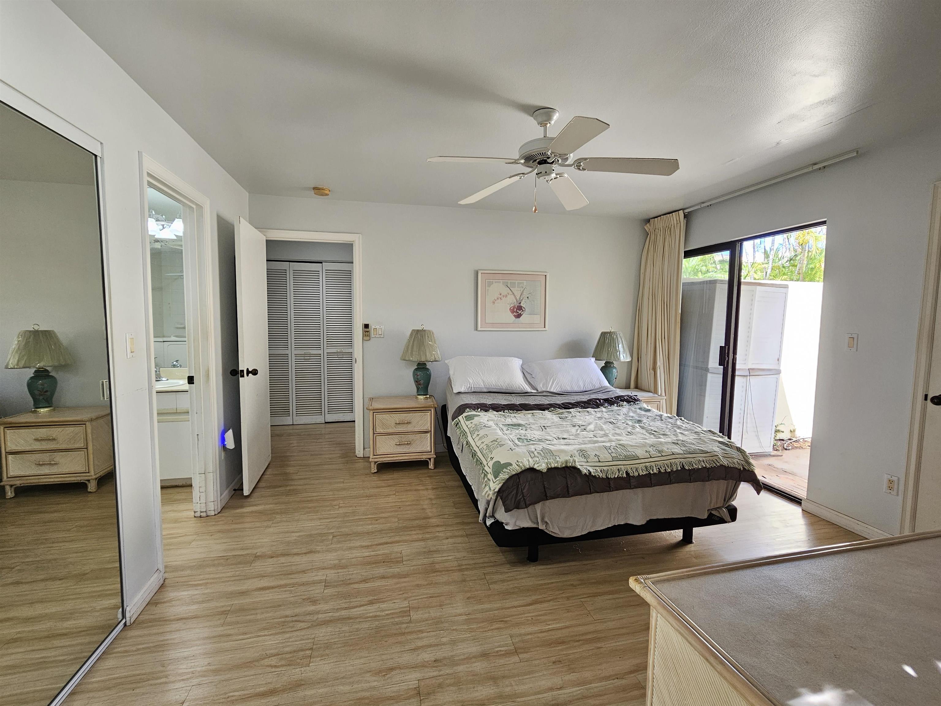 2777 South Kihei Road, Unit K107 Kihei, HI 96753 - Photo 39 of 50 a bedroom with double bed and a chandelier