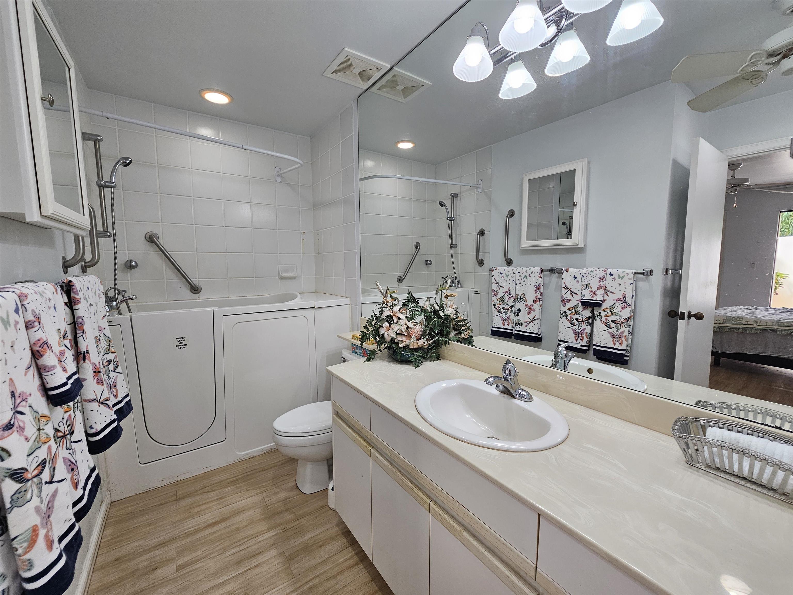 2777 South Kihei Road, Unit K107 Kihei, HI 96753 - Photo 46 of 50 a bathroom with a sink toilet and shower