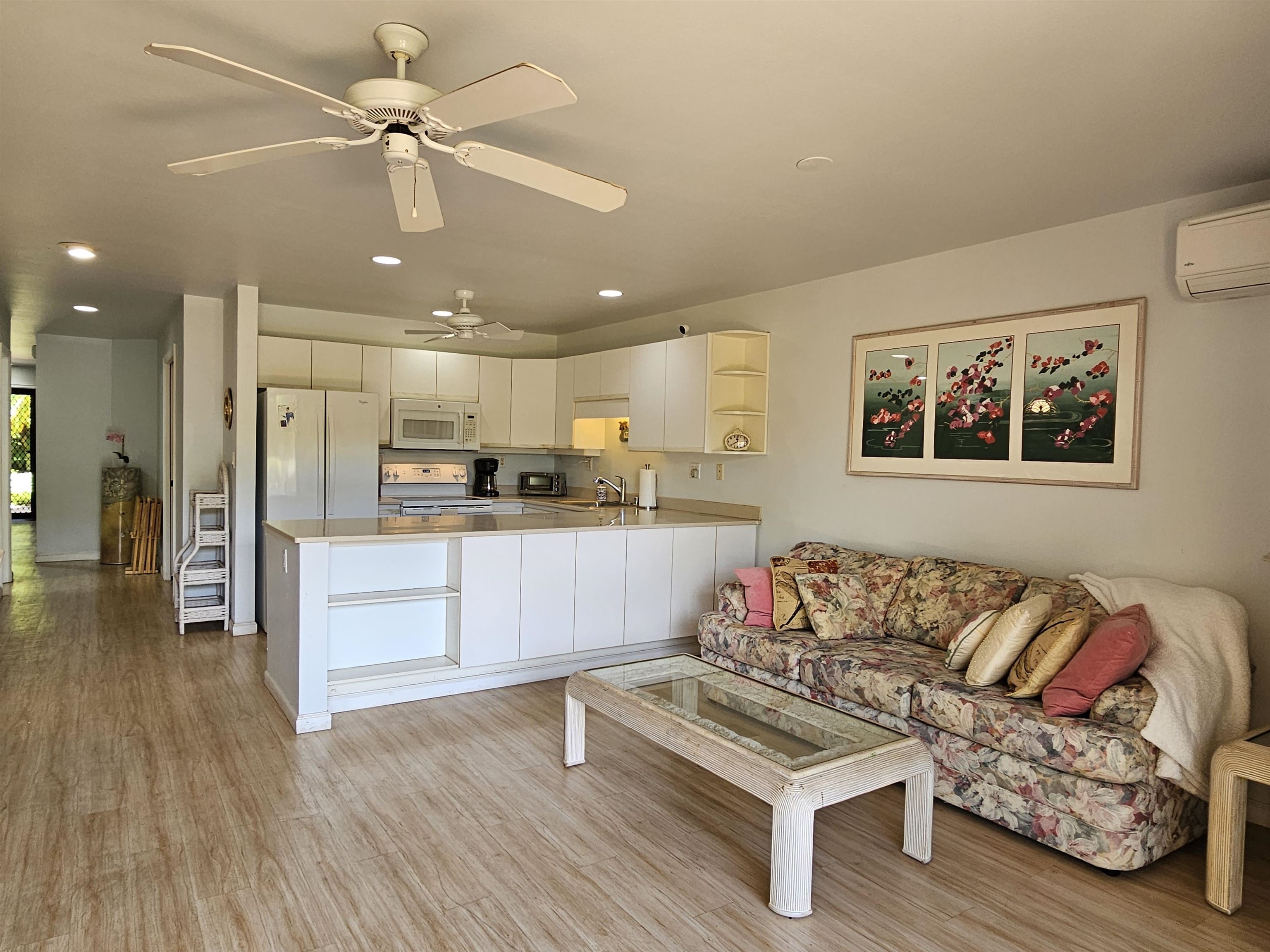 2777 South Kihei Road, Unit K107 Kihei, HI 96753 - Photo 6 of 50 a living room with furniture and kitchen view