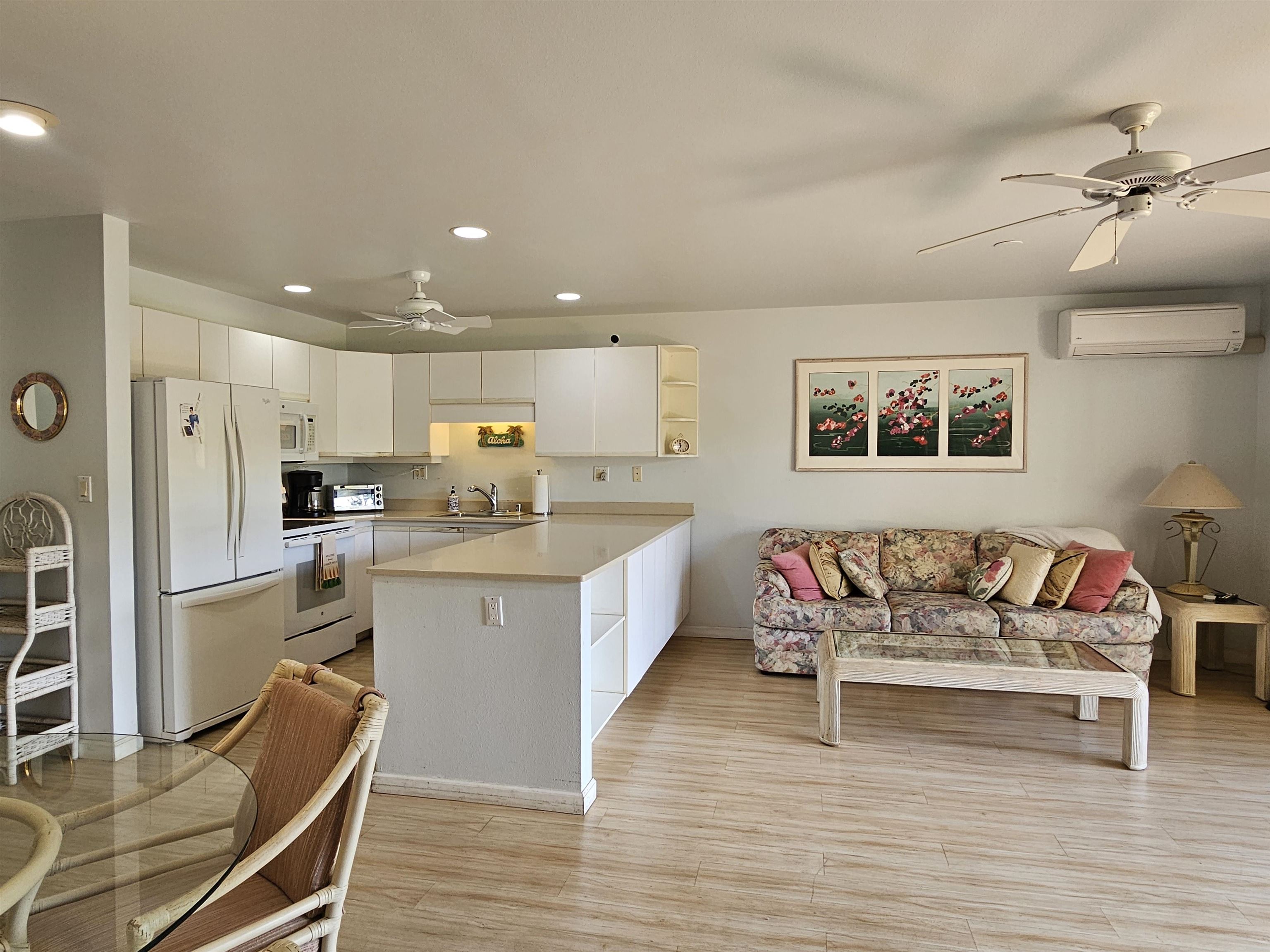 2777 South Kihei Road, Unit K107 Kihei, HI 96753 - Photo 8 of 50 a kitchen with a refrigerator and a sink