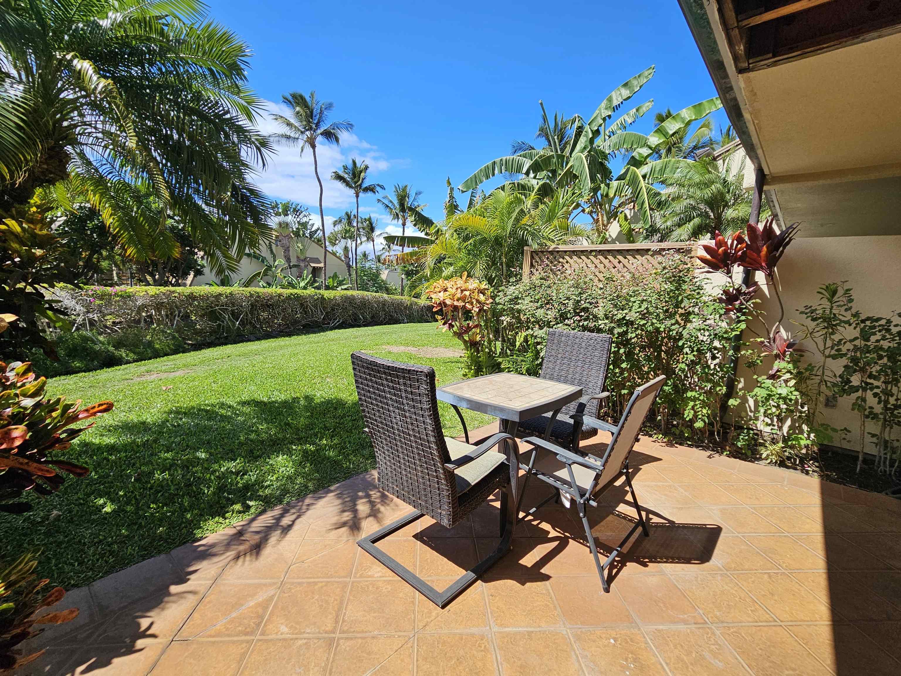2777 South Kihei Road, Unit K107 Kihei, HI 96753 - Photo 10 of 50 a view of a chairs and table in the garden