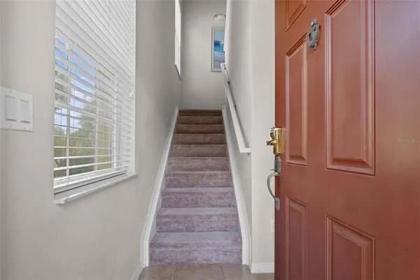 a view of a stairs and an entryway