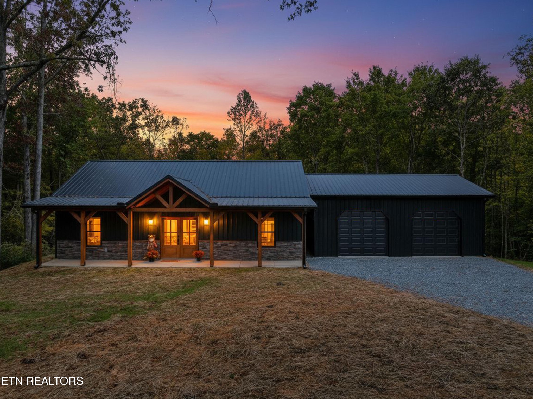 146 Fancher Road Newport, TN 37821 - Photo 1 of 41 a front view of a house with a yard and garage