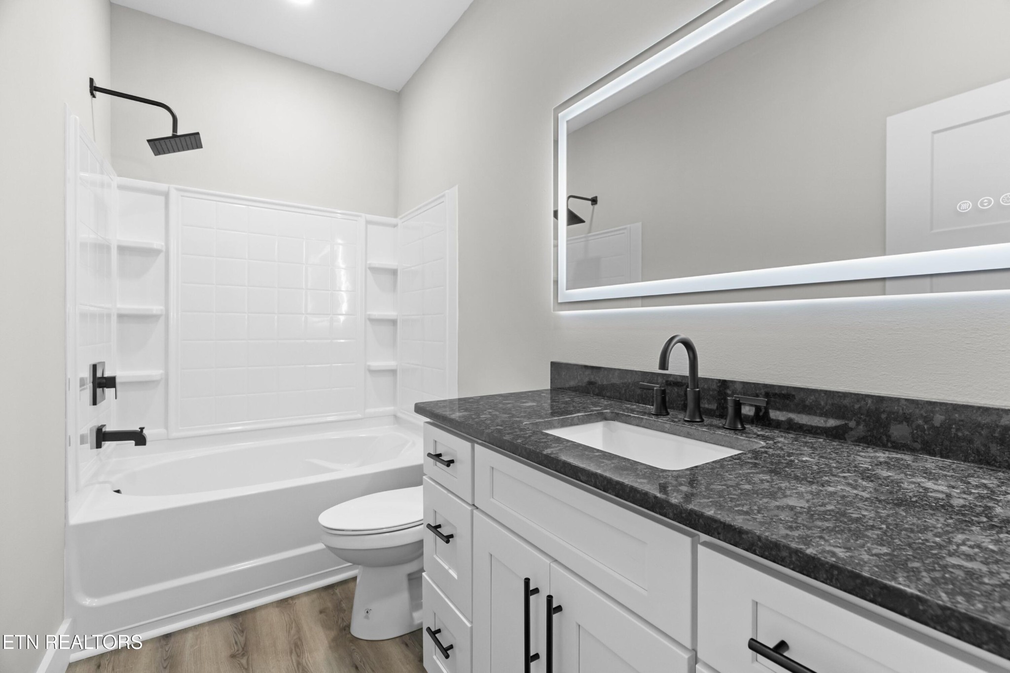 146 Fancher Road Newport, TN 37821 - Photo 14 of 41 a bathroom with a granite countertop sink a toilet and a bathtub