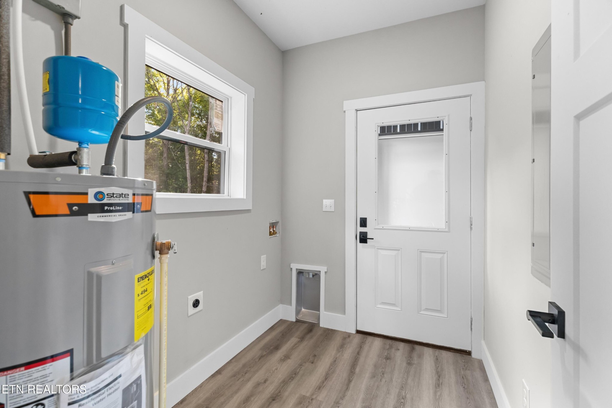 146 Fancher Road Newport, TN 37821 - Photo 15 of 41 a view of empty room with wooden floor and fan