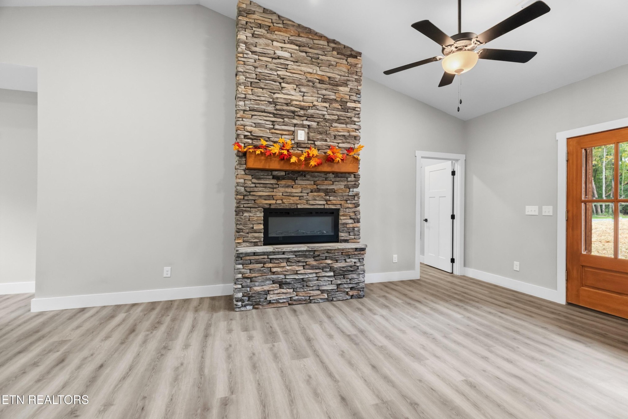 146 Fancher Road Newport, TN 37821 - Photo 18 of 41 a view of an empty room with window and wooden floor