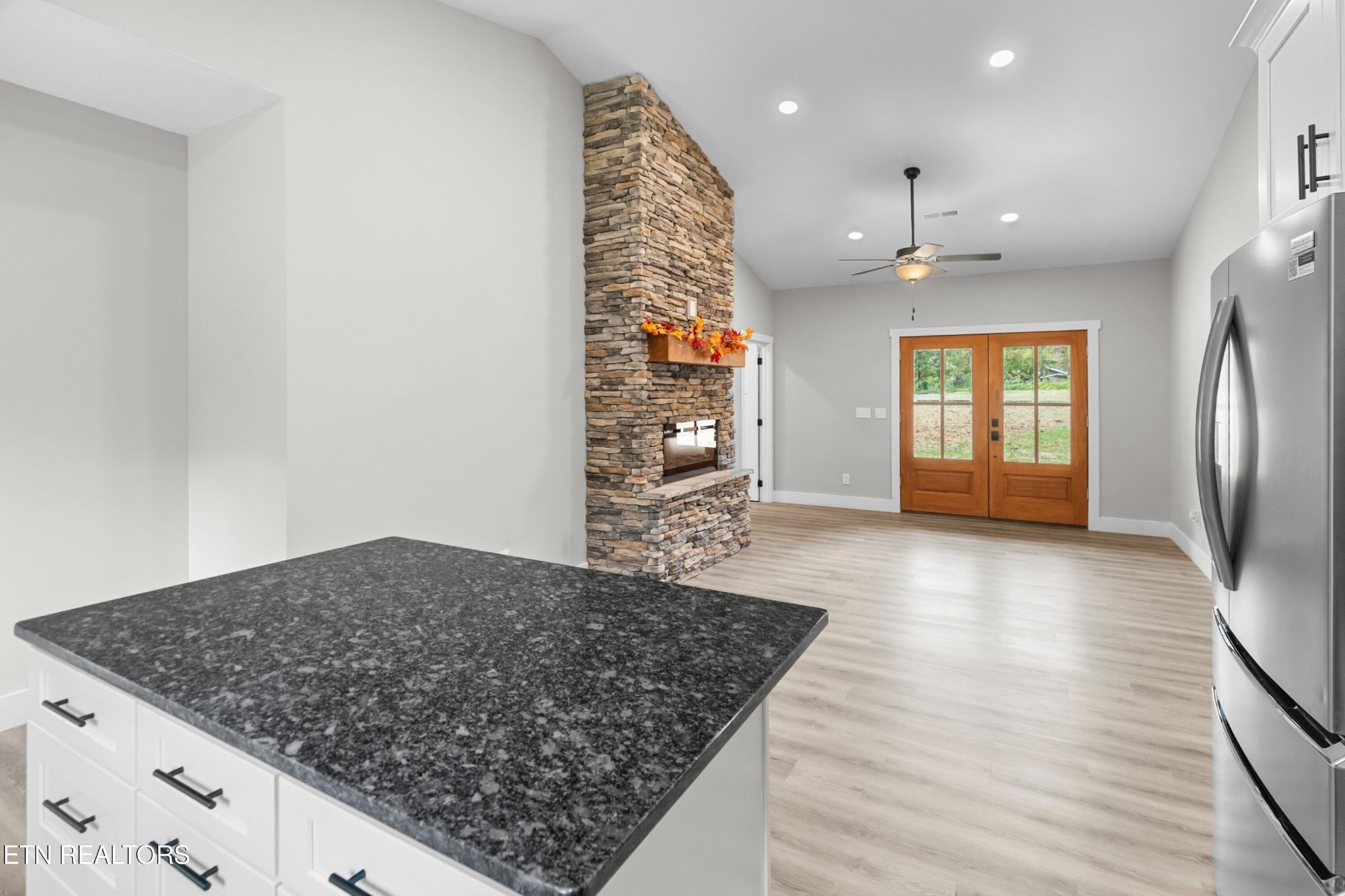 146 Fancher Road Newport, TN 37821 - Photo 21 of 41 wooden floor in an empty room with a kitchen