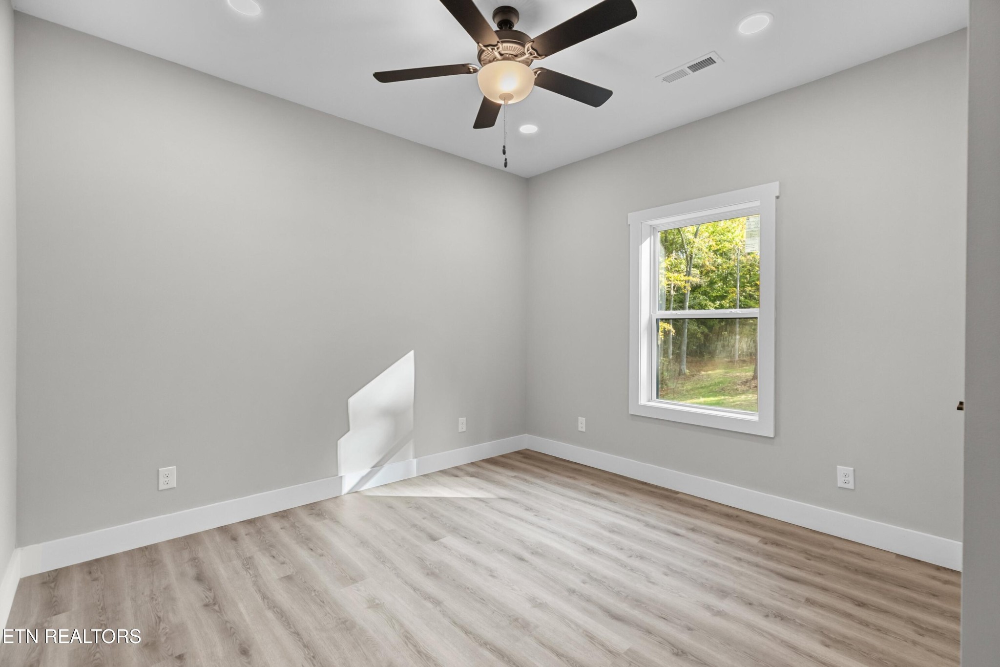 146 Fancher Road Newport, TN 37821 - Photo 24 of 41 an empty room with a window and ceiling fan