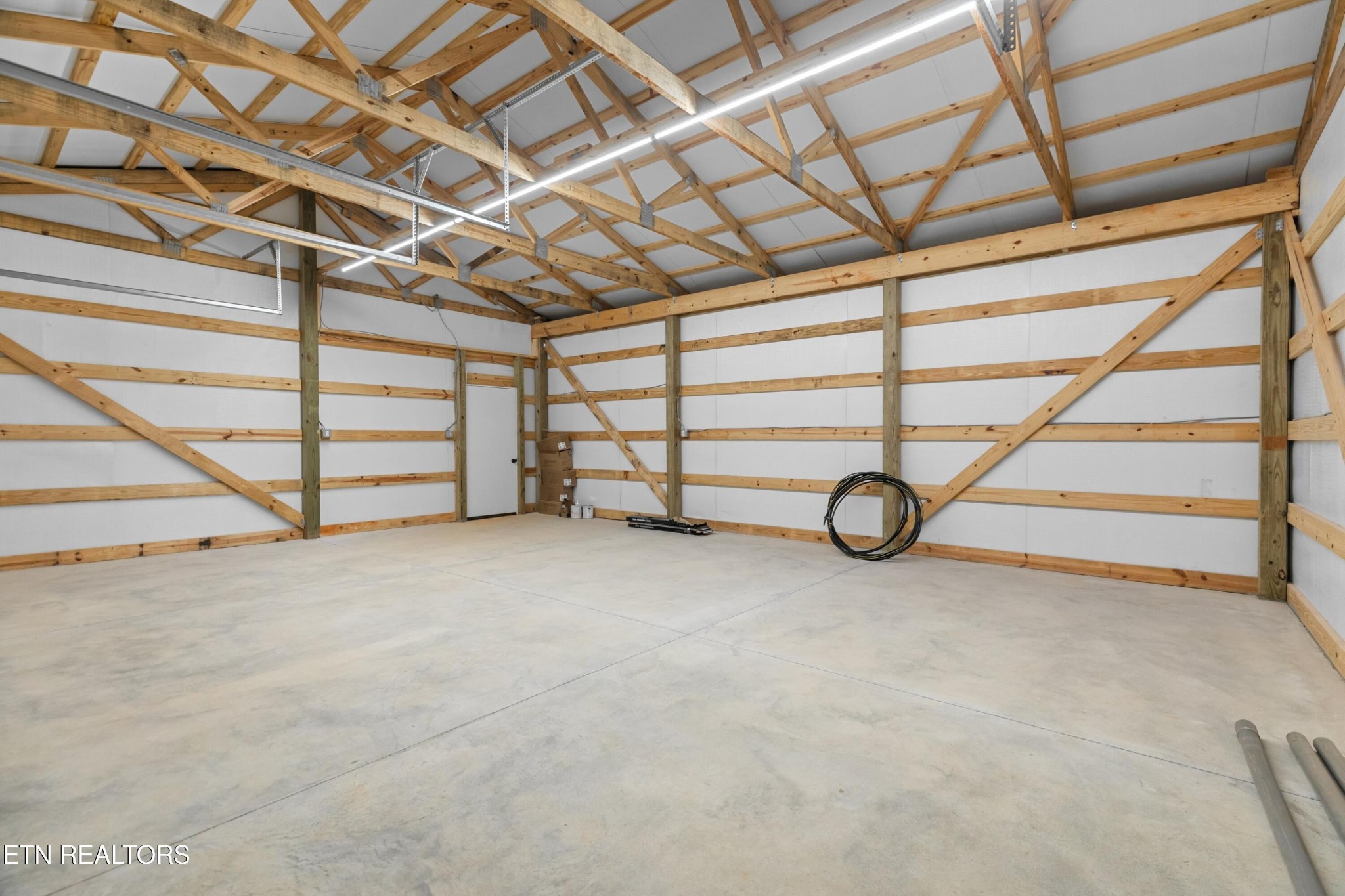 146 Fancher Road Newport, TN 37821 - Photo 30 of 41 a view of a room with wooden walls and air conditioner view