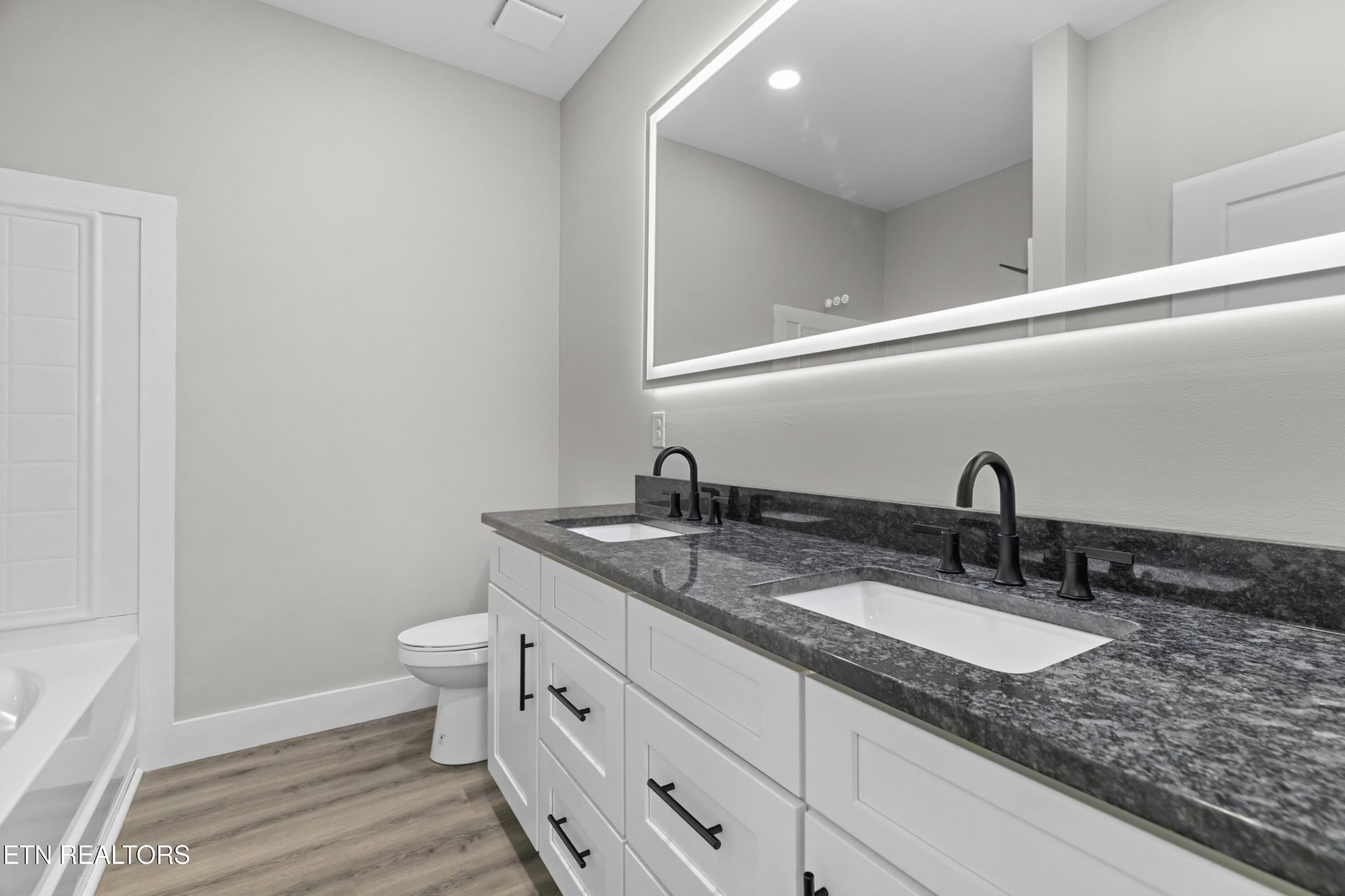 146 Fancher Road Newport, TN 37821 - Photo 10 of 41 a bathroom with a granite countertop sink and a mirror