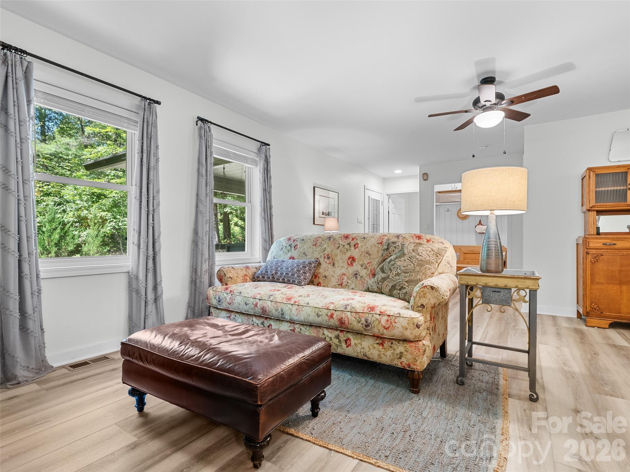 1756 Happy Acres Road Brevard, NC 28712 - Photo 11 of 35 a living room with a bed furniture and a window