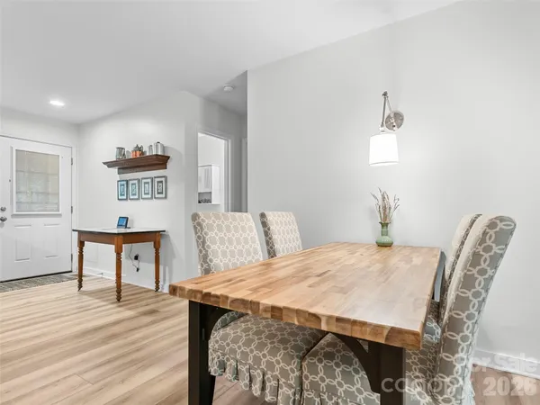 a spacious bedroom with a bed and a table in it