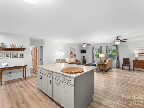 a kitchen with sink refrigerator and stove