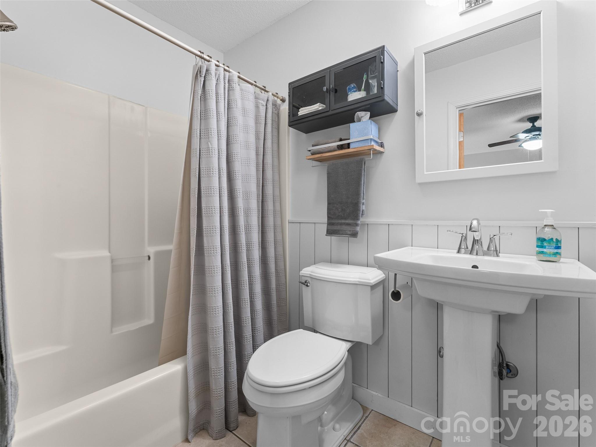 1756 Happy Acres Road Brevard, NC 28712 - Photo 29 of 35 a bathroom with a sink toilet and shower