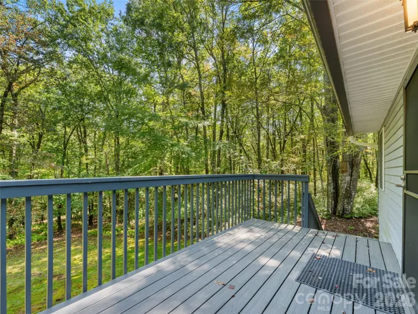 a view of balcony with wooden floor
