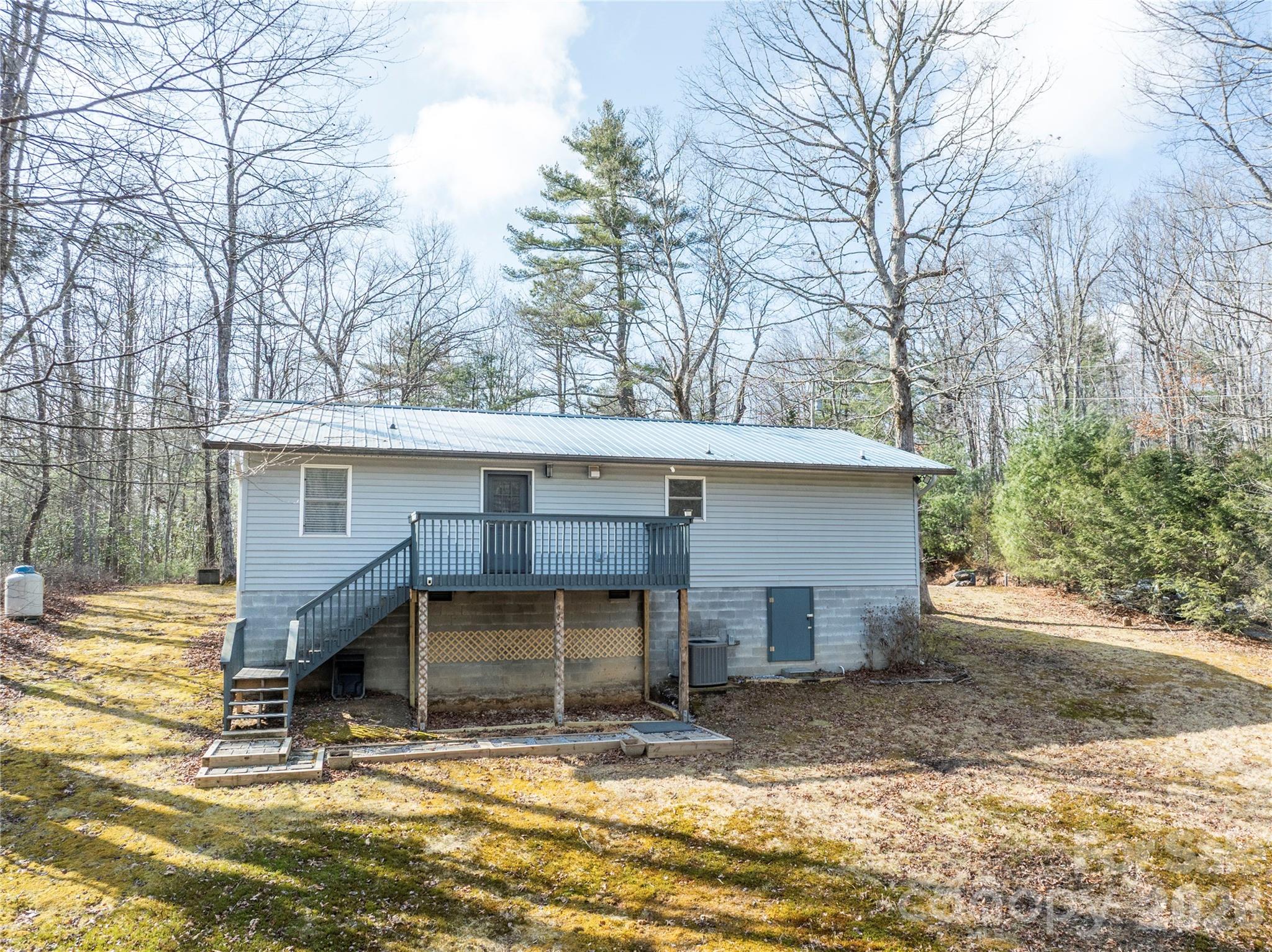 1756 Happy Acres Road Brevard, NC 28712 - Photo 35 of 35 a view of a house with large space and a large tree
