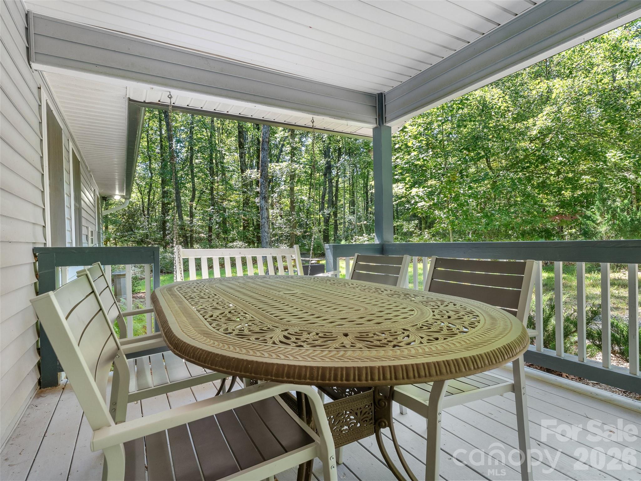 1756 Happy Acres Road Brevard, NC 28712 - Photo 4 of 35 a view of a chairs and table in the balcony