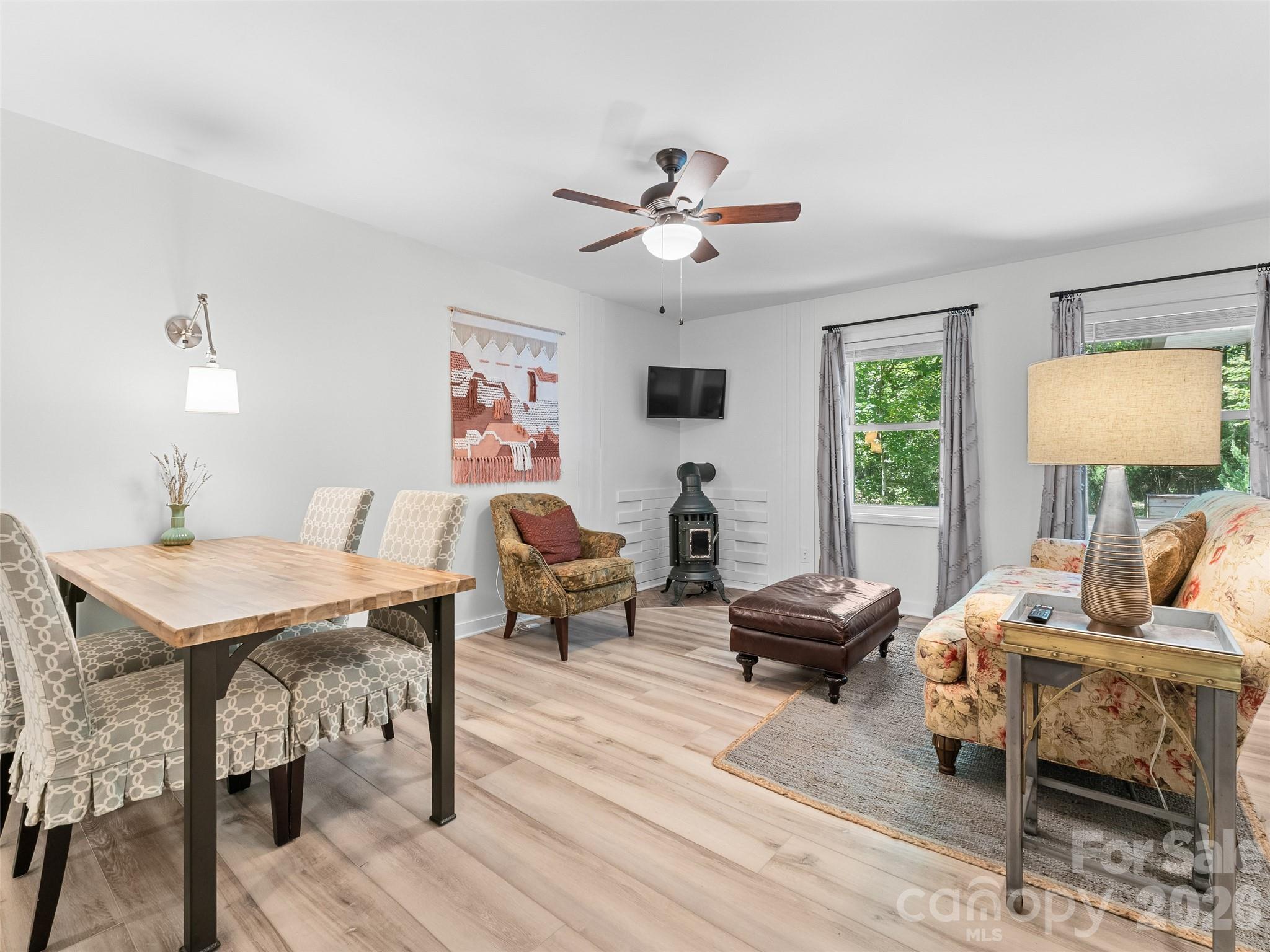 1756 Happy Acres Road Brevard, NC 28712 - Photo 10 of 35 a living room with furniture a table and a large window