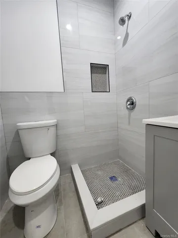 a kitchen with granite countertop a stove sink and microwave