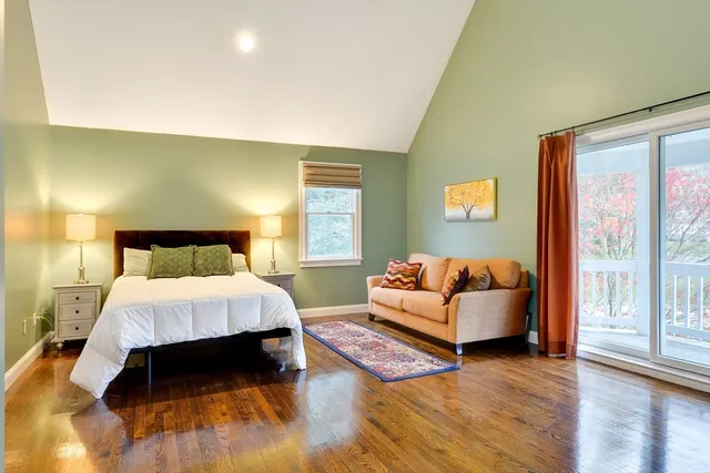 a bedroom with a bed and a lamp