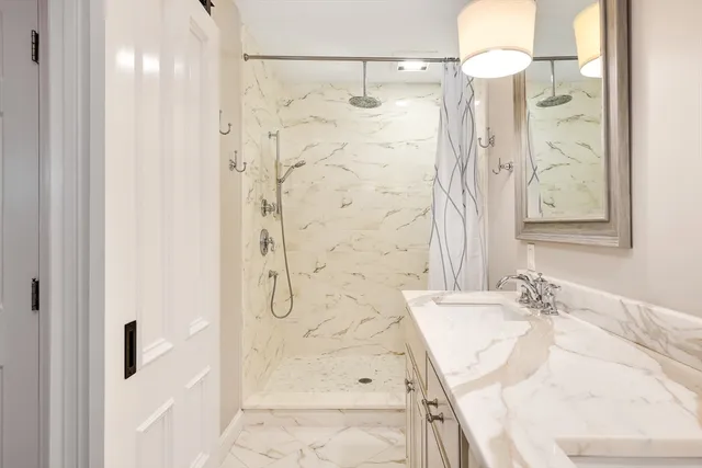 a bathroom with a double vanity sink mirror and double