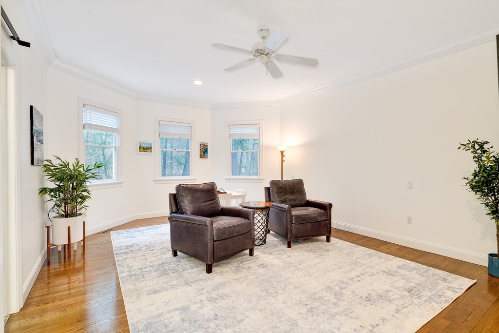 22 Forest Lane, Unit 22 Scituate, MA 02066 - Photo 18 of 27 a living room with furniture and a potted plant