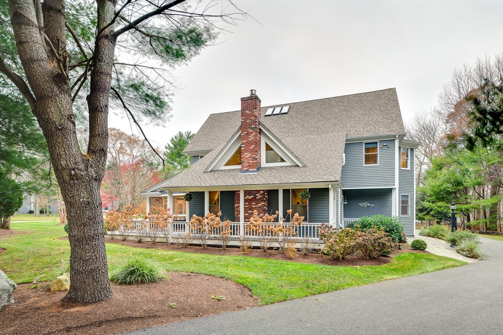 22 Forest Lane, Unit 22 Scituate, MA 02066 - Photo 21 of 27 a front view of a house with a yard