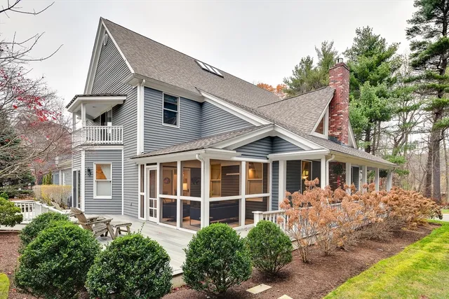 a aerial view of a house with a yard and potted plants