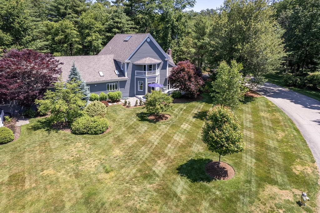 22 Forest Lane, Unit 22 Scituate, MA 02066 - Photo 24 of 27 a aerial view of a house with a yard and potted plants