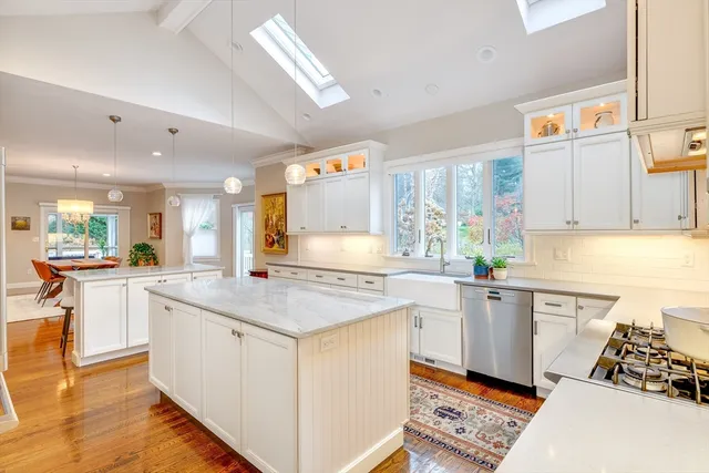 a kitchen with a sink stove and cabinets