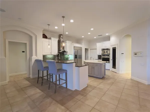 a bathroom with a granite countertop sink a mirror and a vanity