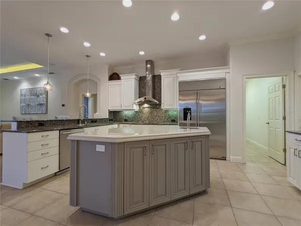 a kitchen with granite countertop a sink and cabinets