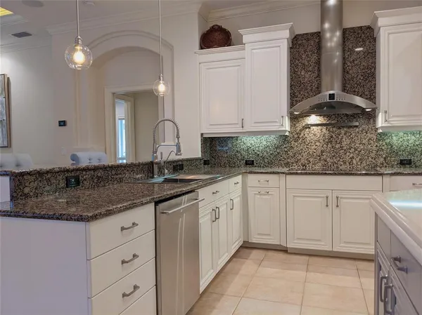 a spacious bathroom with a granite countertop sink a mirror and shower