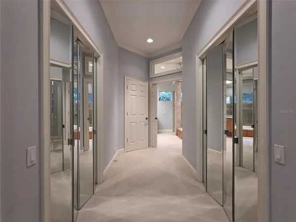 a bathroom with a tub a sink and mirror