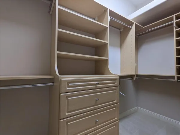 a spacious bathroom with a granite countertop sink mirror and bathtub