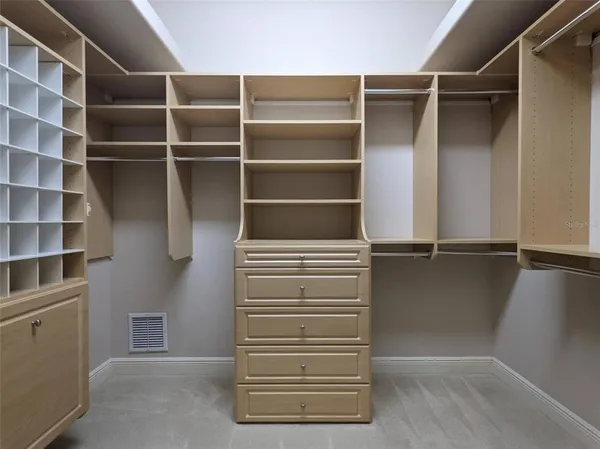 a spacious bathroom with a tub a sink and mirror