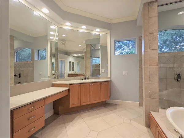 a bedroom with a bed and a chair