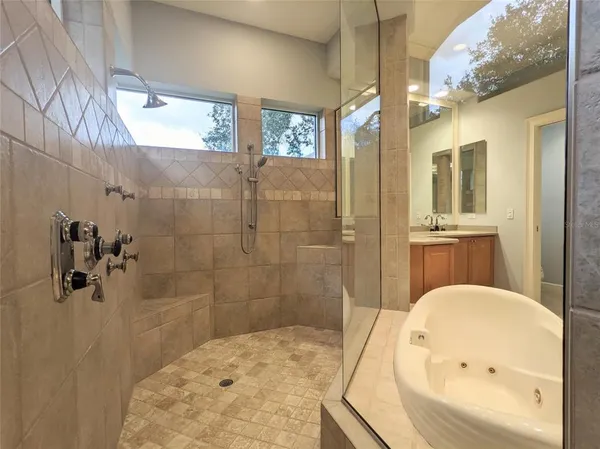 a bedroom with a bed and a night stand