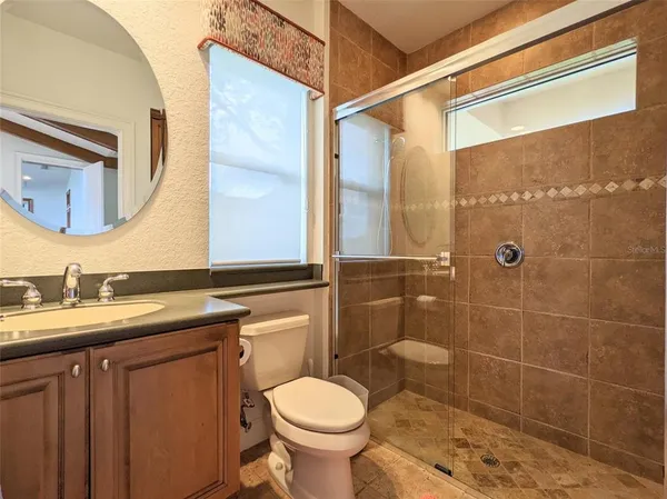 a view of lake with houses in the back