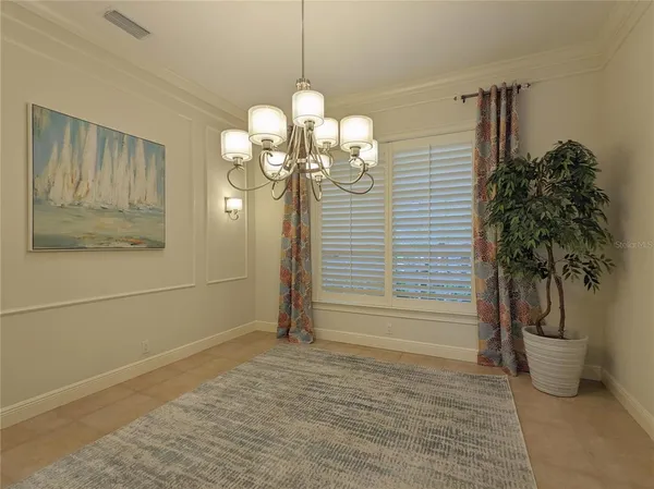 a view of a livingroom with furniture window and wooden floor
