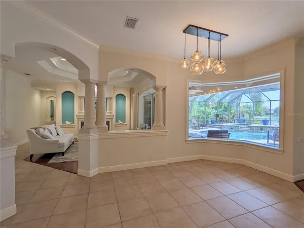 a living room with a fireplace and wooden floor