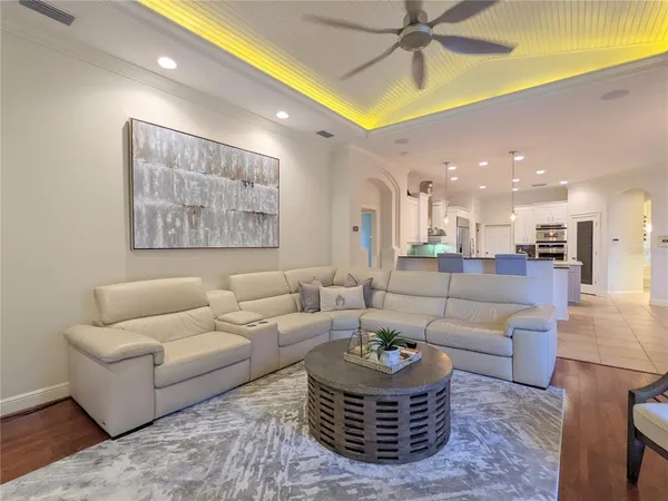 a kitchen with a sink and chairs