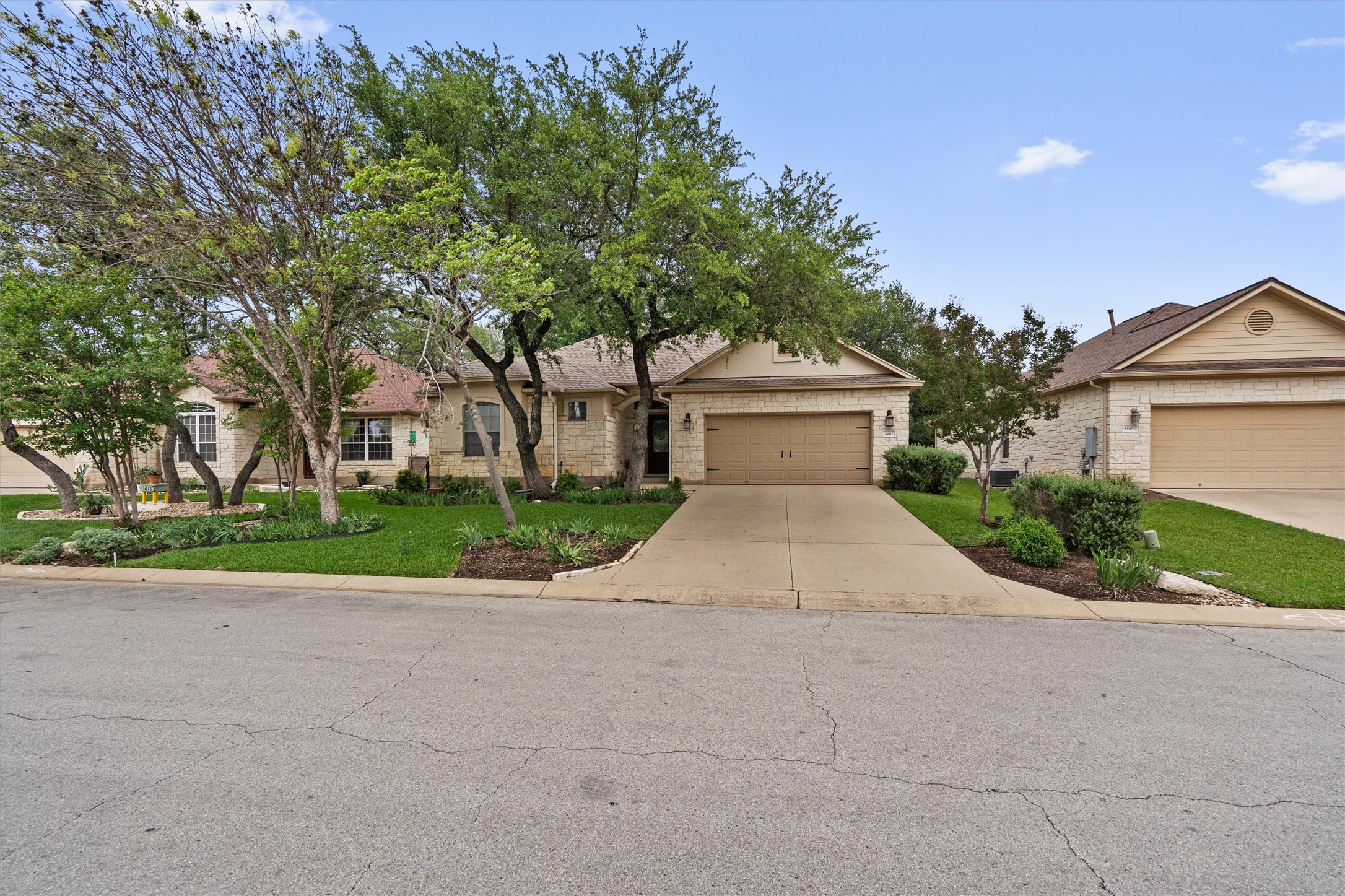 4612 Sonora Trace Georgetown, TX 78633 - Photo 35 of 36 a view of a house with a yard and large tree