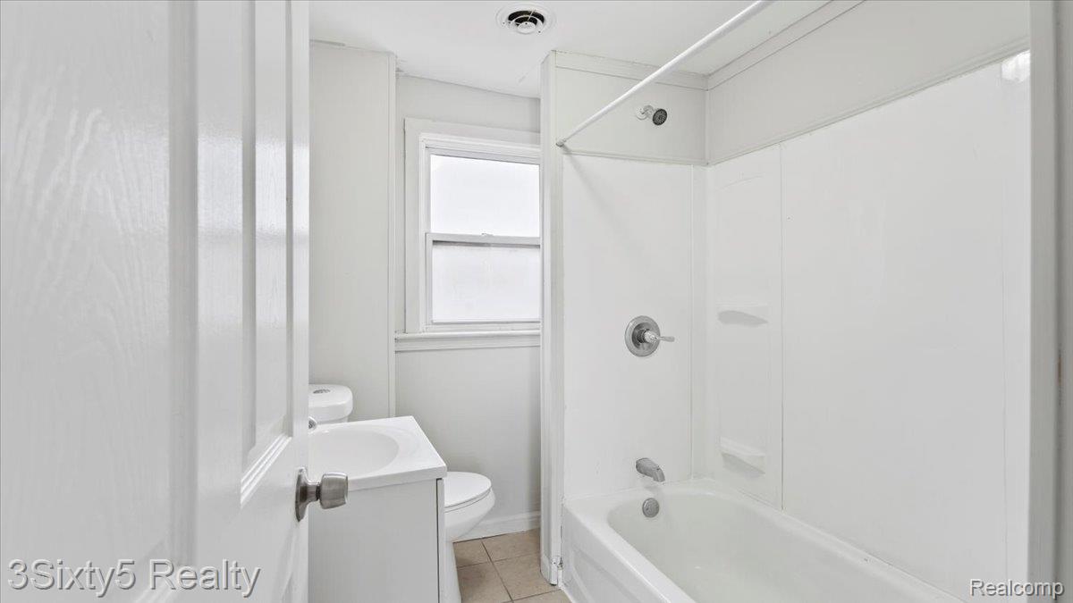79 East Pleasant Street River Rouge, MI 48218 - Photo 5 of 6 Full bath with vanity, shower / washtub combination, and light tile patterned flooring