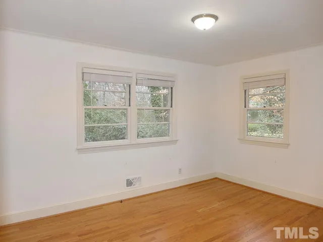 a bathroom with a sink mirror and toilet